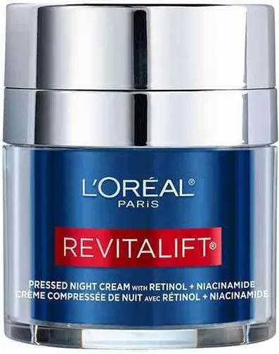 Słoiczek kremu L'Oréal Revitalift prezentuje etykietę informującą o retinolu i niacynamidzie na białym tle.