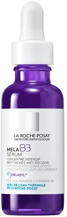 Fioletowa butelka serum stoi z białą pipetą, oznaczona La Roche-Posay, na neutralnym tle.