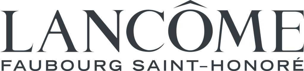 Logo Lancôme wyeksponowane, otoczone mniejszym napisem "Faubourg Saint‑Honoré", na ciemnym tle.